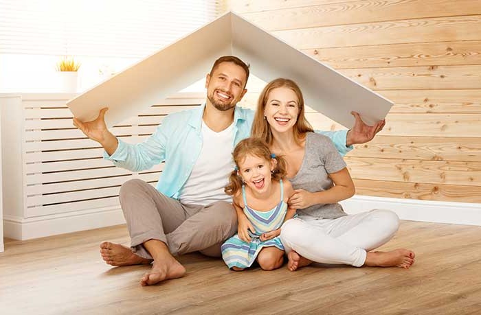 Family Sitting in Home 